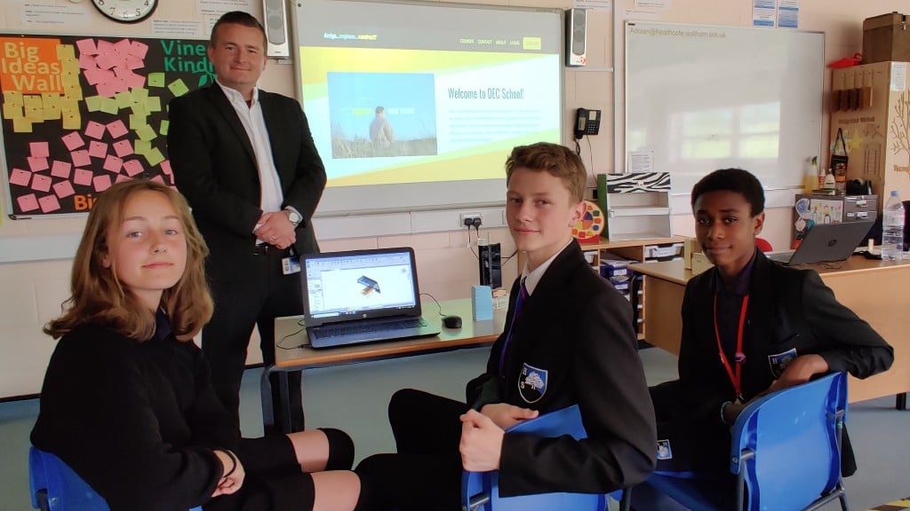 Students pose for a photo in class