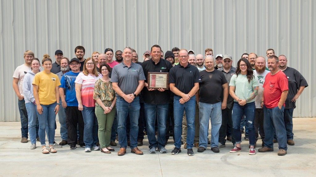 Minnich employees pose for an award photo