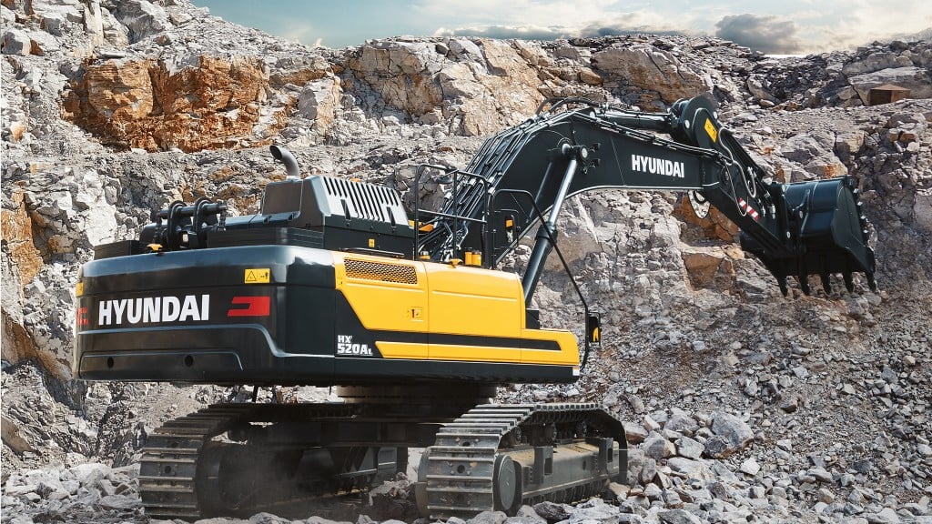 A Hyundai excavator digs on the job site