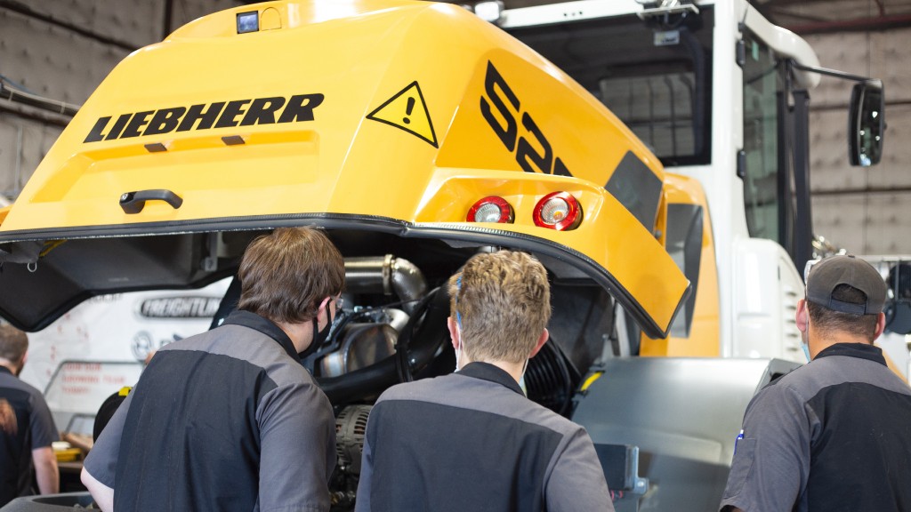 Students learn diesel repair on Liebherr equipment