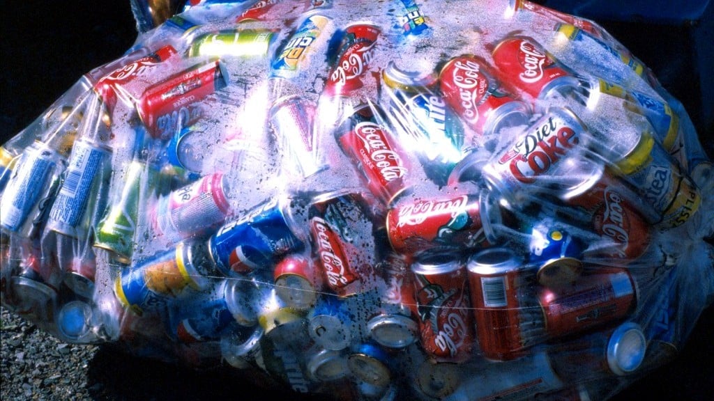 A plastic bag filled with aluminum cans