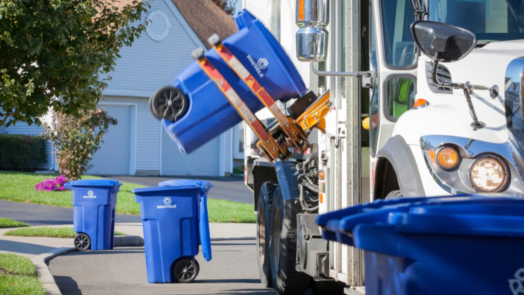 A collection truck collects curbside recycling