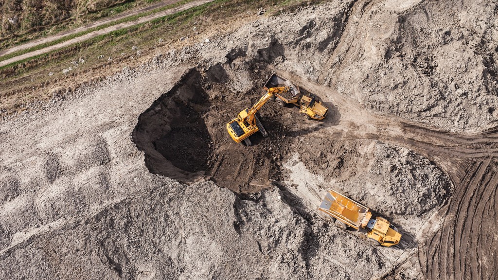 A trimble excavator loads dirt on the job site