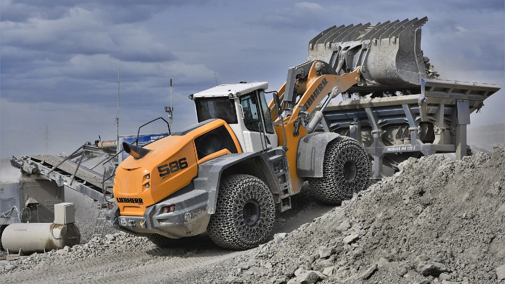 A Liebherr wheel loader loading a crusher on the job site