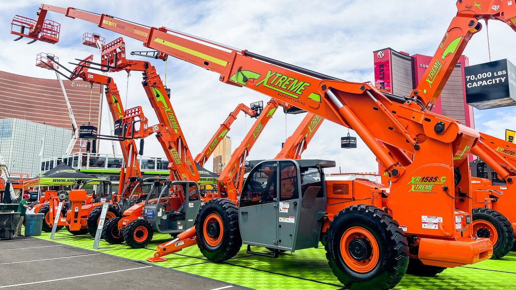 Fixed boom handlers parked at a trade display