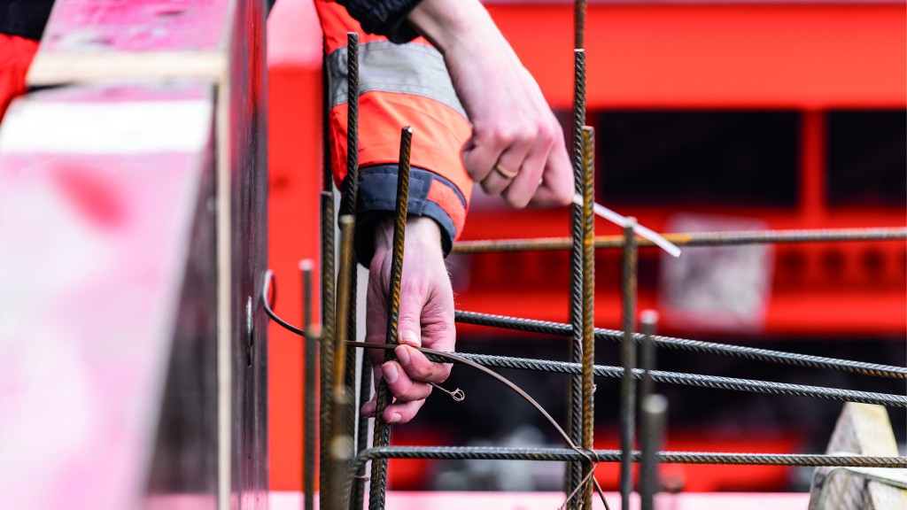 A worker installs a temperatuer sensor cable