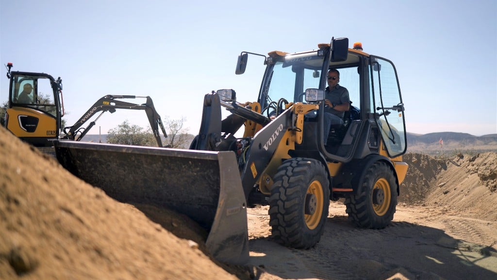 Volvo CE electric compact wheel loader and compact excavator working in California