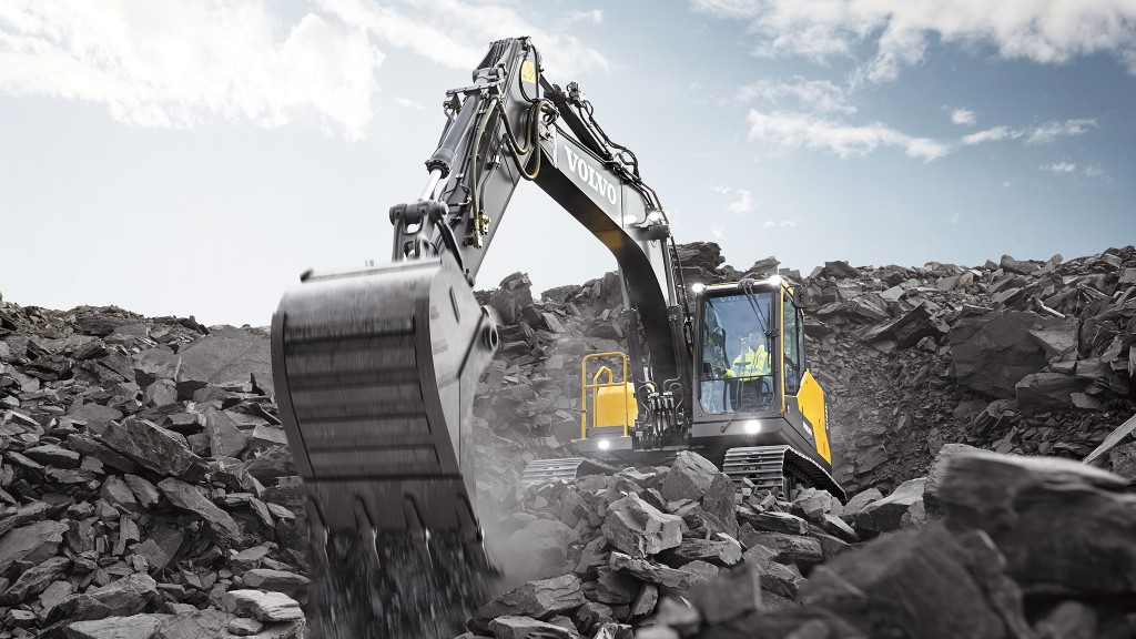 Volvo excavator moving large rock