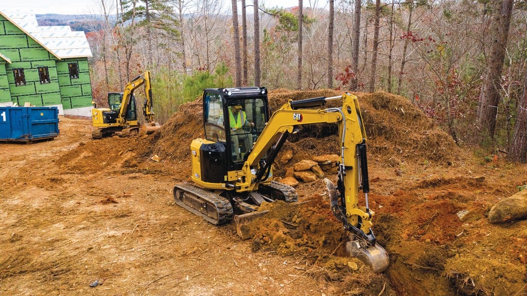 Cat mini excavator trenches for residential development