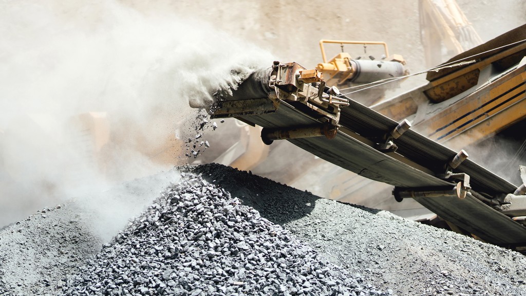 Crushed rock falling from crusher conveyors