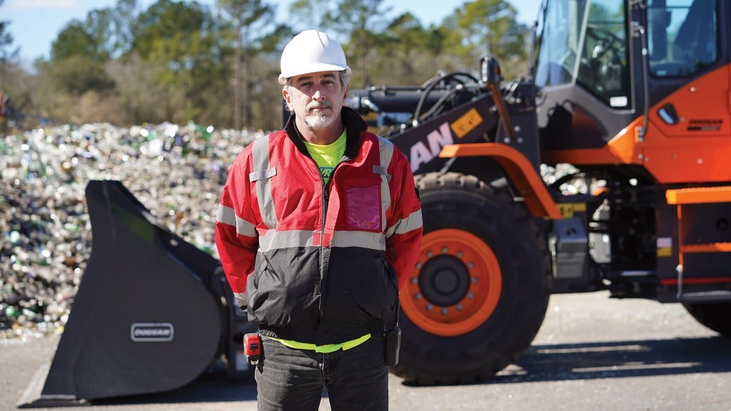 Brad Graham of GlassWRX, in front of his new Doosan DL220-5 wheel loader.