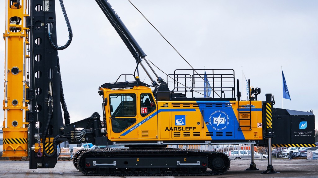 An electric drill rig parked in a parking lot