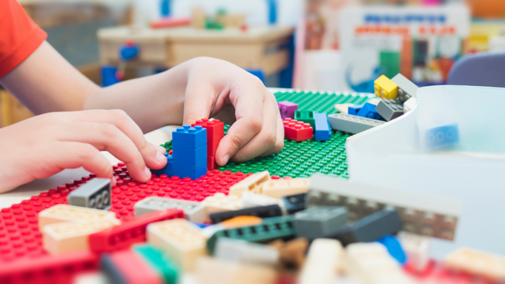 A child plays with LEGO at school