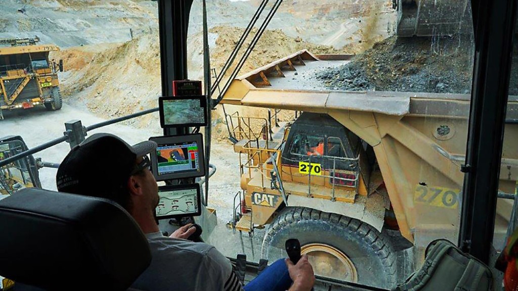 A Cat mining truck viewed from inside a Cat mining shovel cab