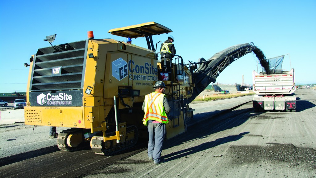 Cat cold planer feeding into a dump truck