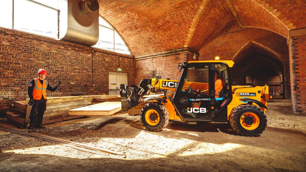 An electric compact telehandler on the job site