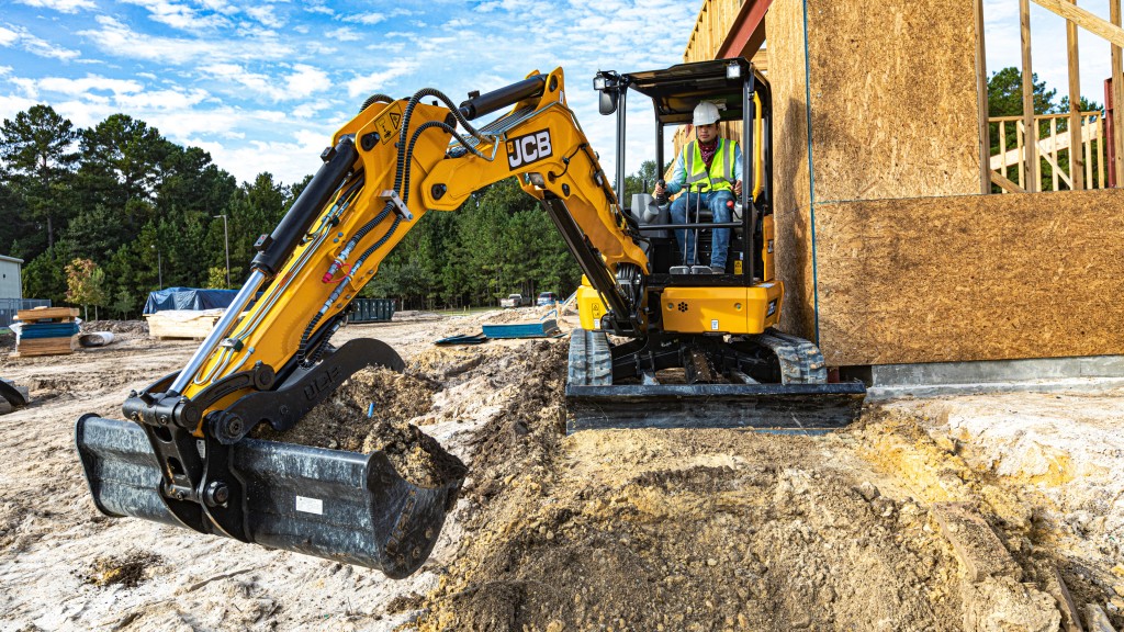 A JCB compact excavator on the job site