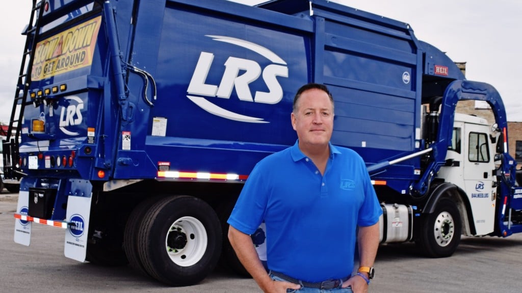 LRS president and CEO stands in front of a collection truck