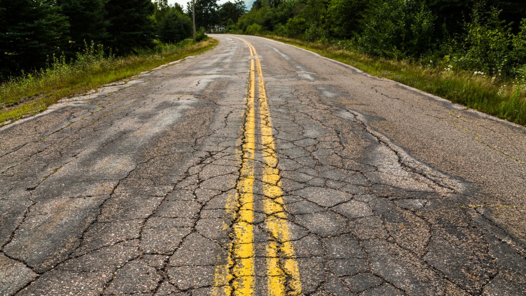 A cracked road in need of repair