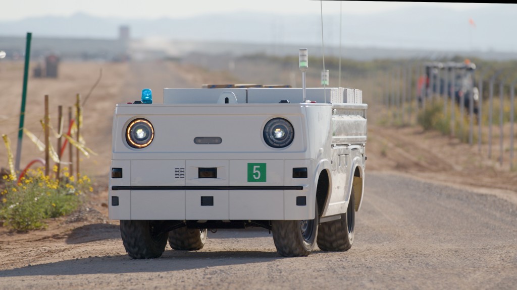 An autonomous work vehicle driving on a job site