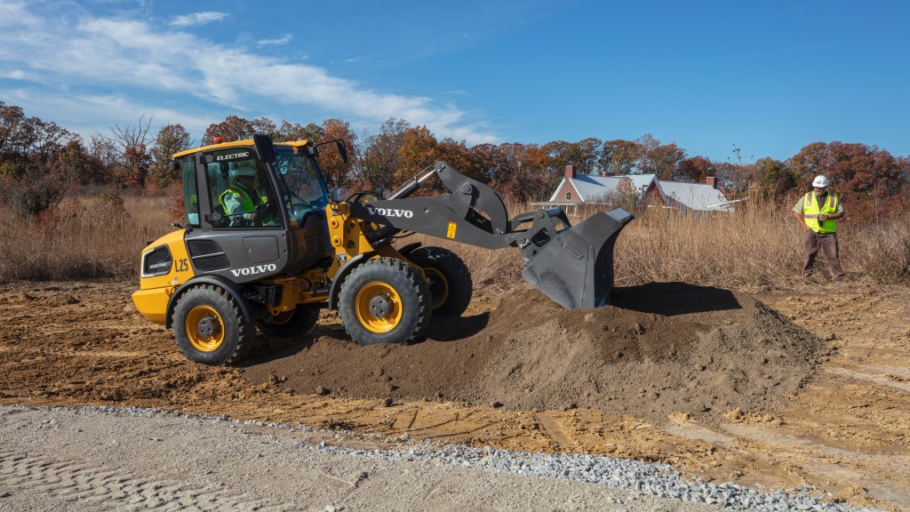 A compact electric wheel loader moves dirt at a wildlife refuge