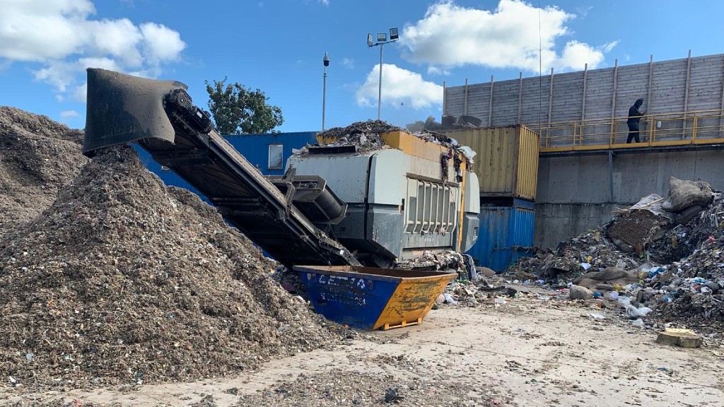 A mobil-e shredder shreds materials on the job site