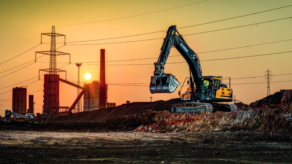 A Hyundai excavator moves dirt on a job site