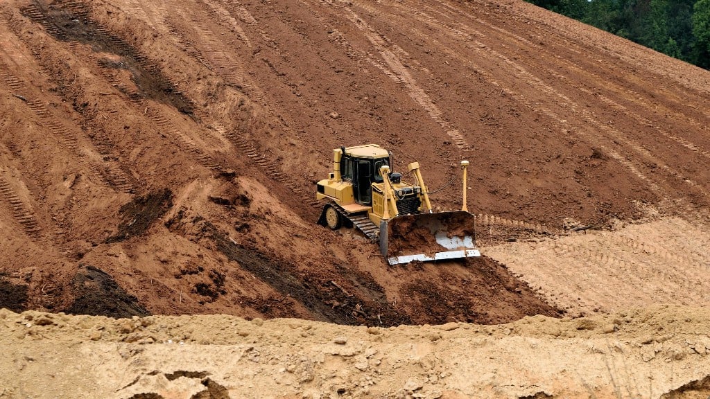 A dozer moves dirt on a job site