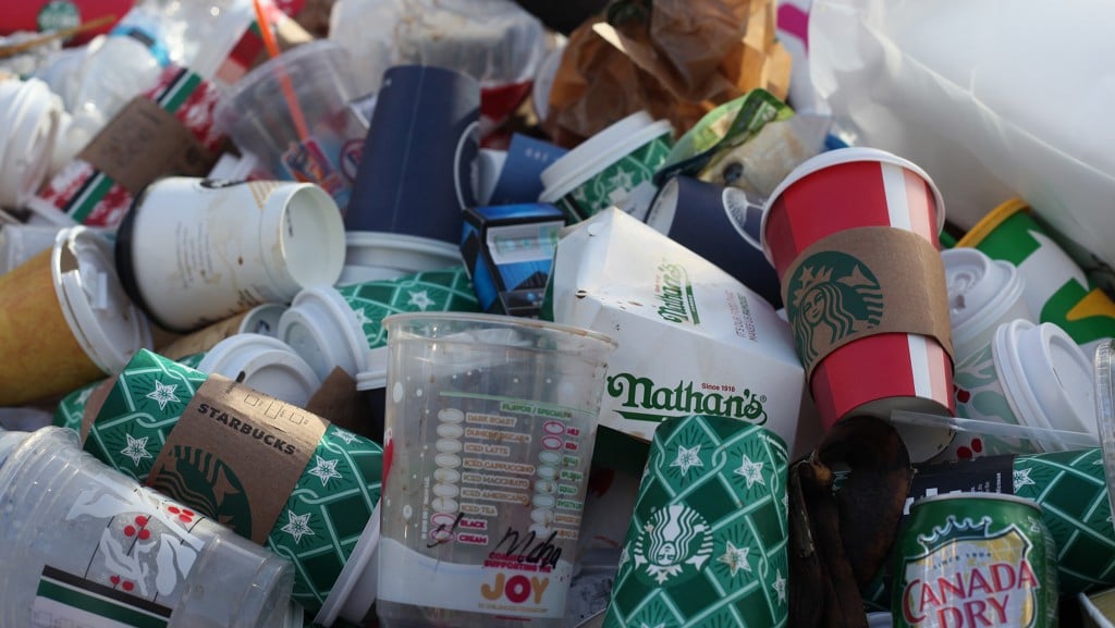 Mixed plastic and beverage cup waste in a pile
