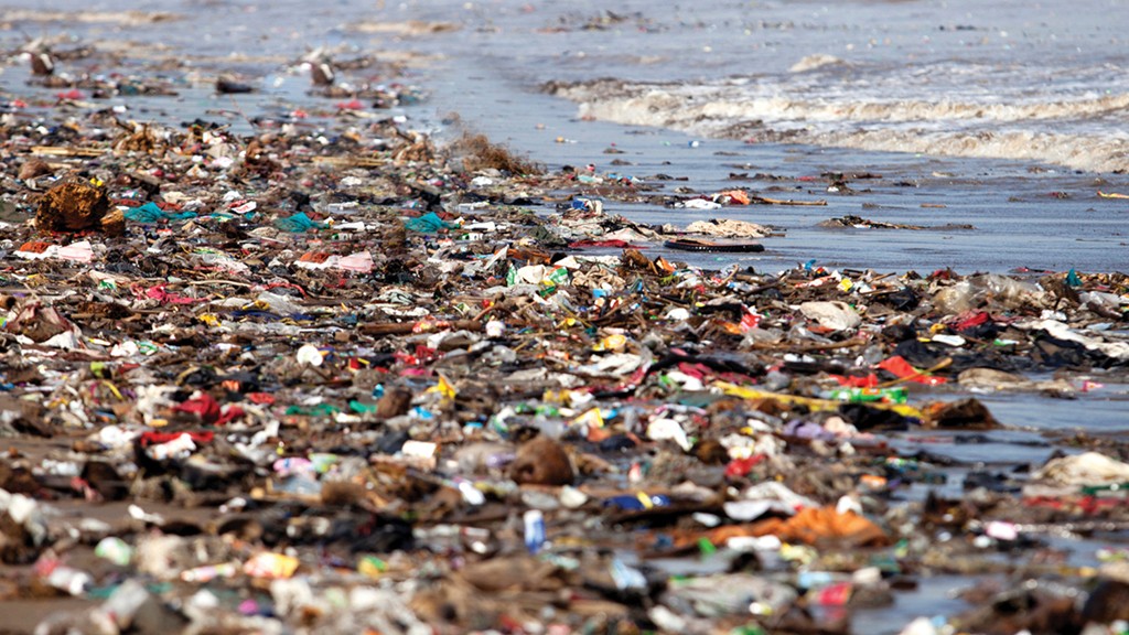 Severe plastic polluted beach shoreline