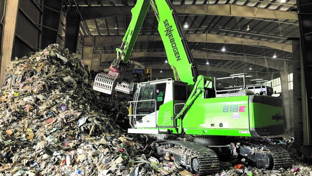A material handler collecting waste materials