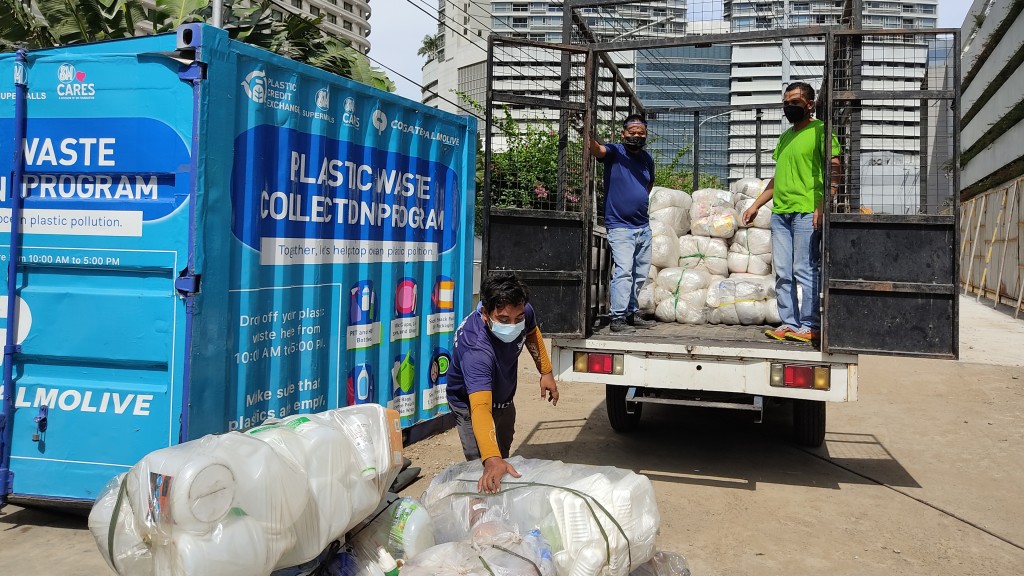 A PCX partner collecting plastic waste