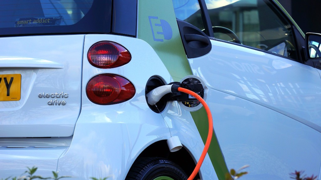 An electric vehicle being charged