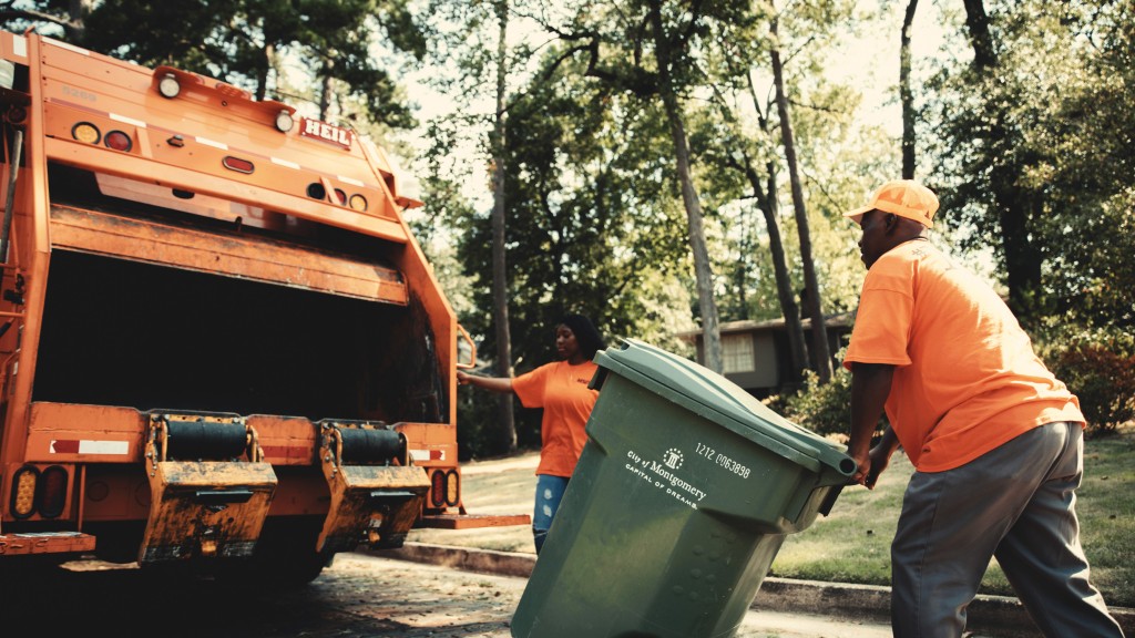 A collection worker collects curbside waste