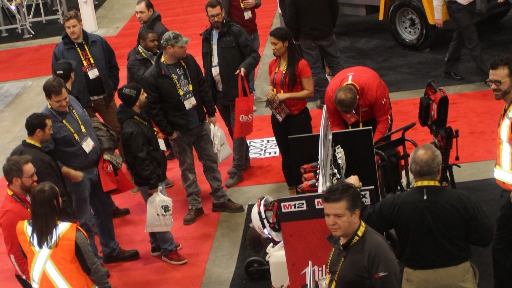 People walk around and view a Canadian Concrete Expo booth