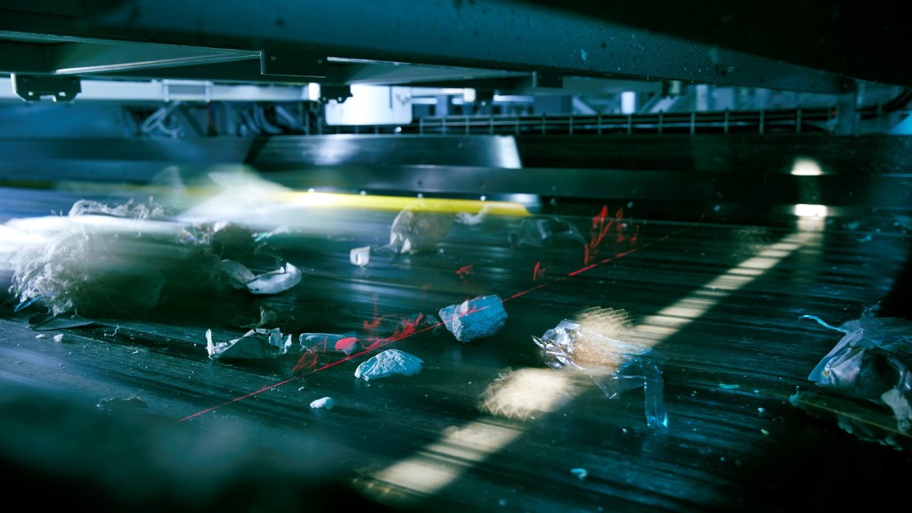 A sorting system scans material on a conveyor