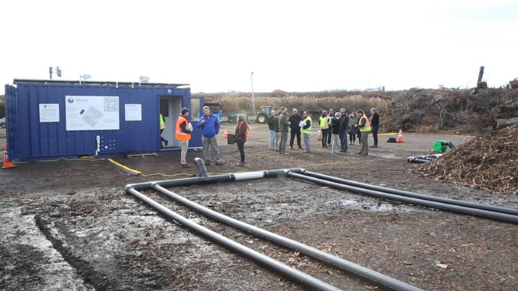 Workers stand around a EASP Modular Unit