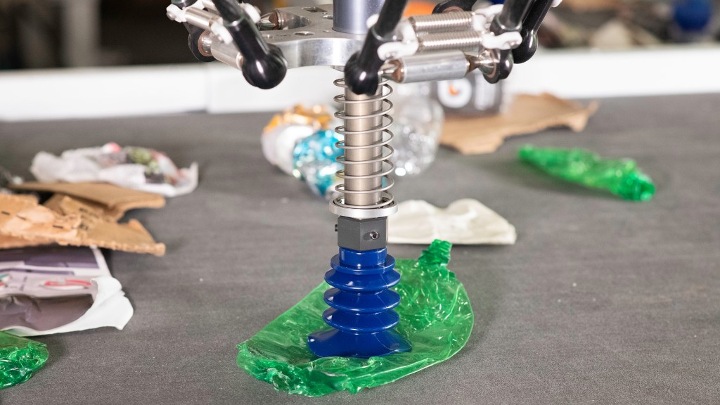 An AI-robotic sorting system plunger picking up plastic