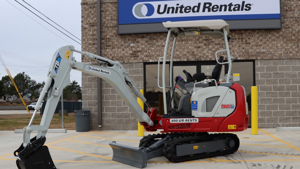 An electric compact excavator parked at a United Rentals