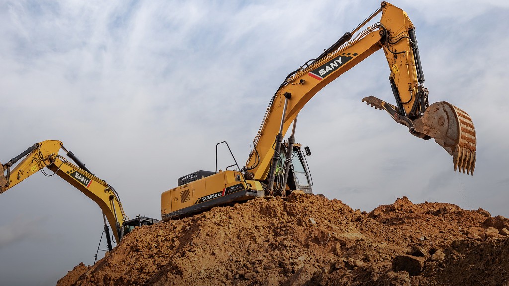 An excavator digging dirt on a job site