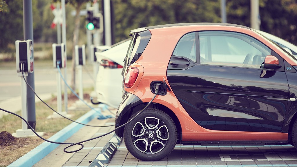 Electric cars charging in a parking lot