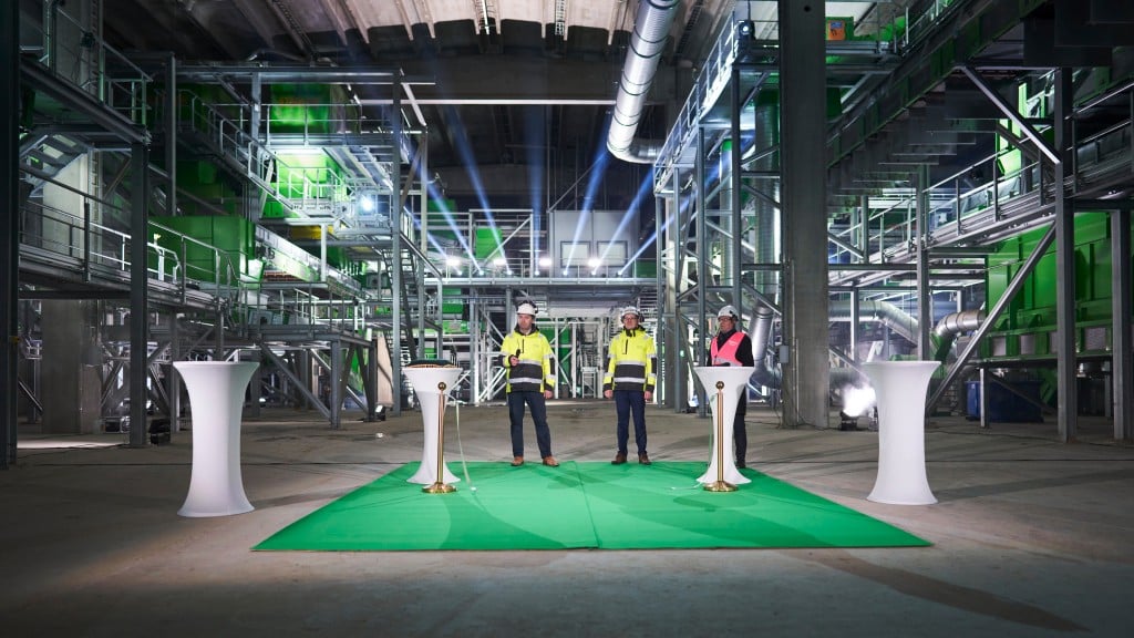 Workers and employees finishing a ribbon cutting event