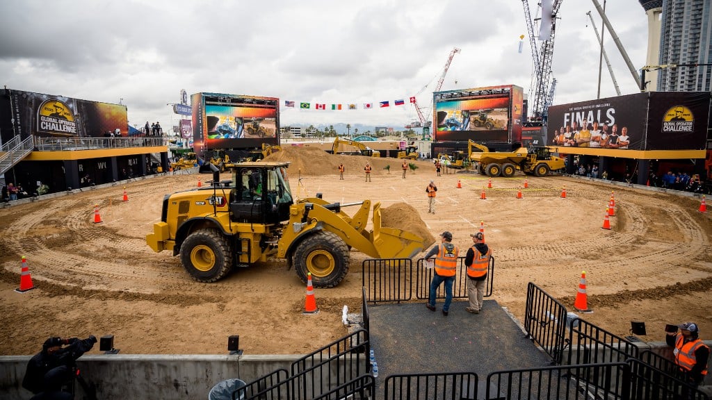 A wheel loader moves dirt around an arena