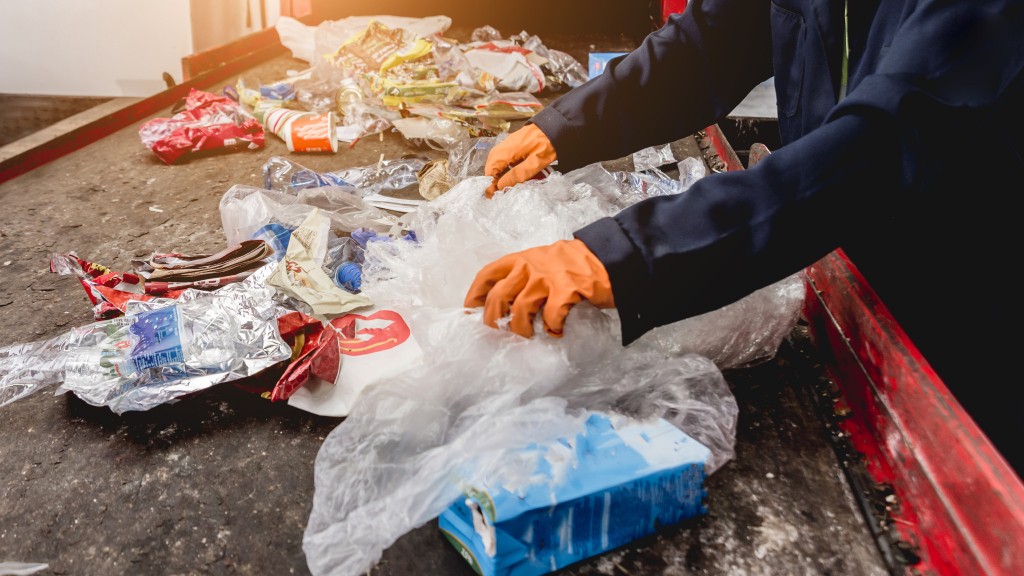 Workers sort through plastic packaging