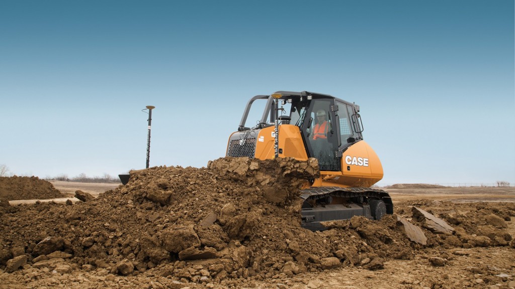 A dozer pushes dirt on a job site