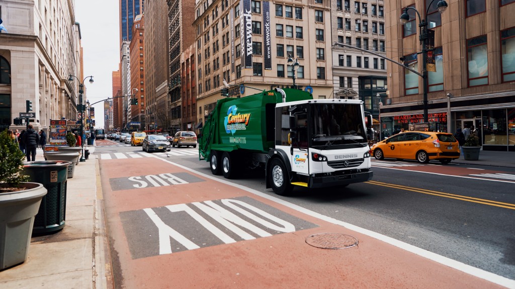 A collection truck on a city street