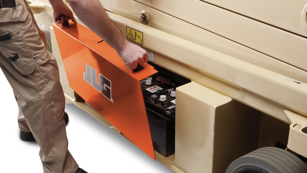Opening the battery compartment of a JLG scissor lift