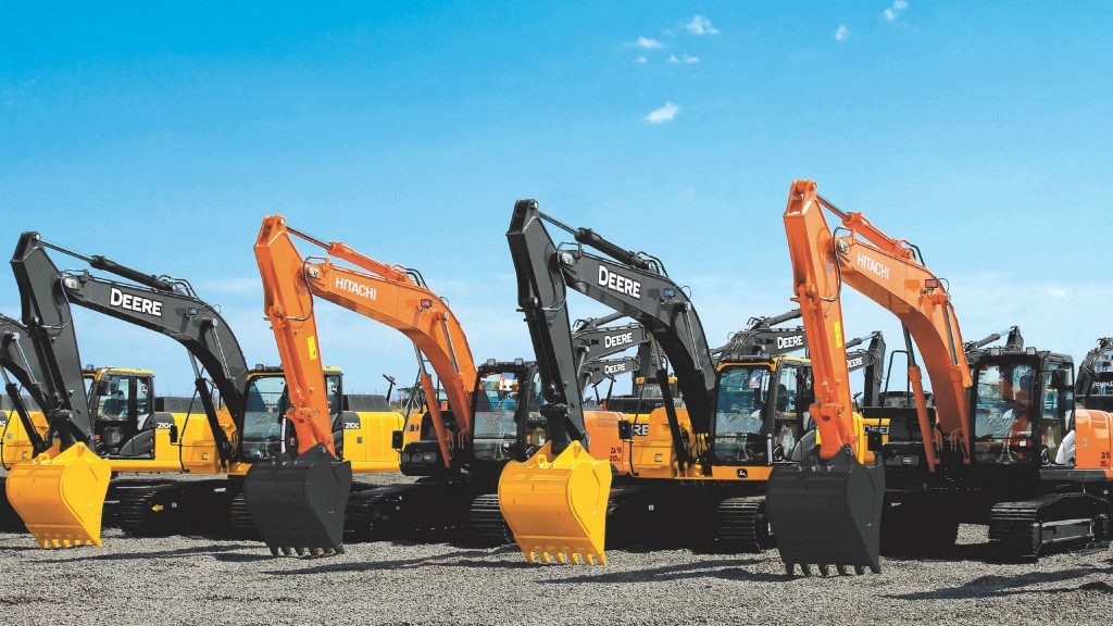 John Deere and Hitachi excavators parked in a line
