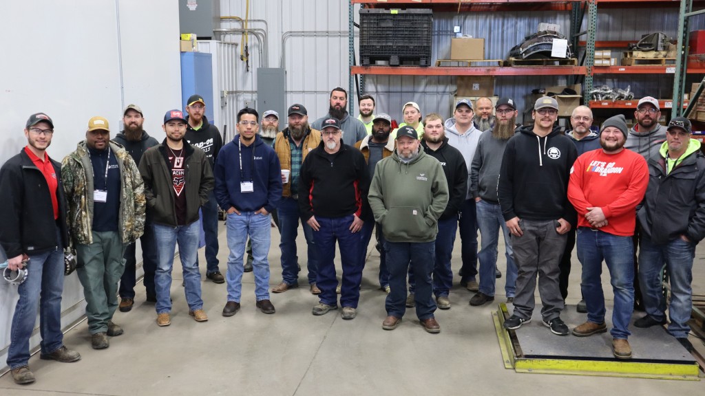 Machine owners stand for a photo