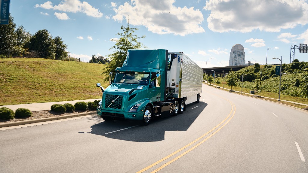 An electric truck driving on a highway